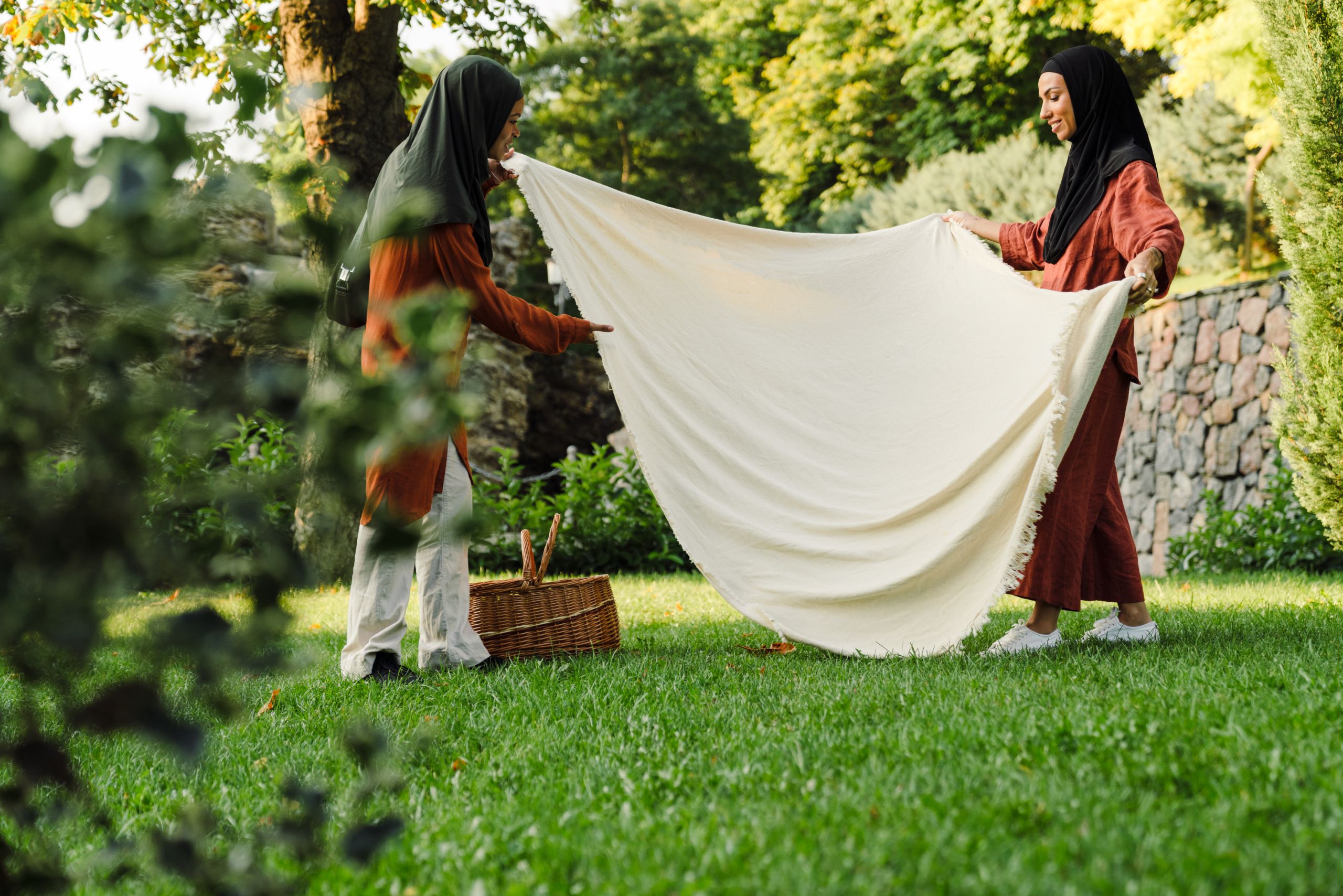 multiracial muslim women making place for picnic i 2025 02 15 21 58 06 utc