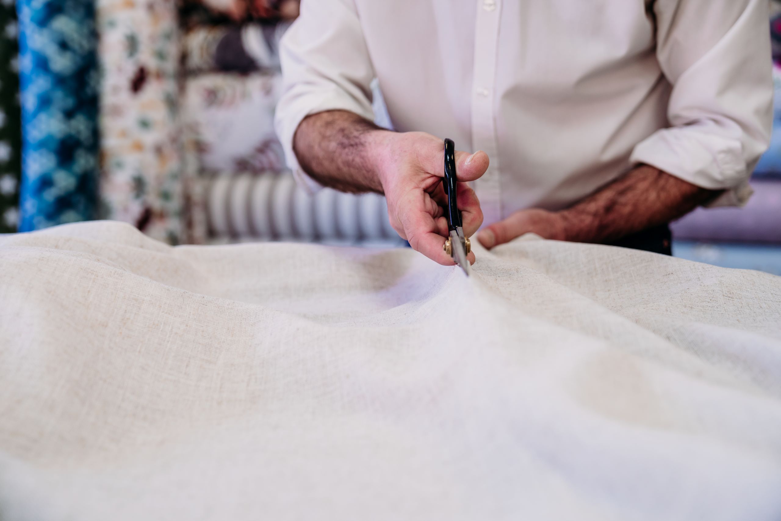 senior man working in atelier cutting curtains sm 2024 11 02 23 44 36 utc